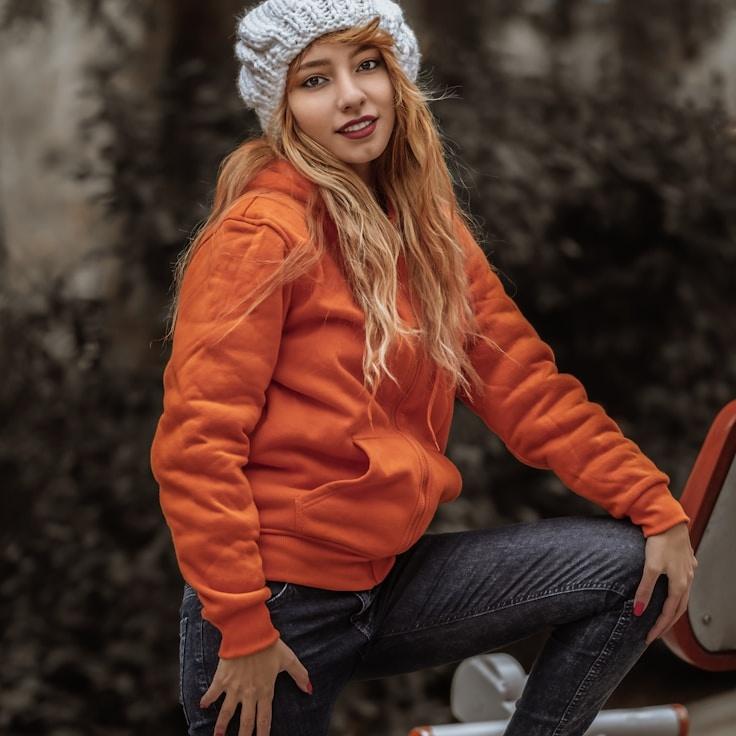 Aria Chen, Lead Design Curator at Tranquil River Symphony, reviewing corporate floral arrangements